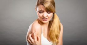 Woman Grabbing Her Shoulder in Pain Atlanta GA 