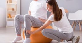 Physical Therapist Giving Rehabilitation Treatment to Male Patient Atlanta GA 